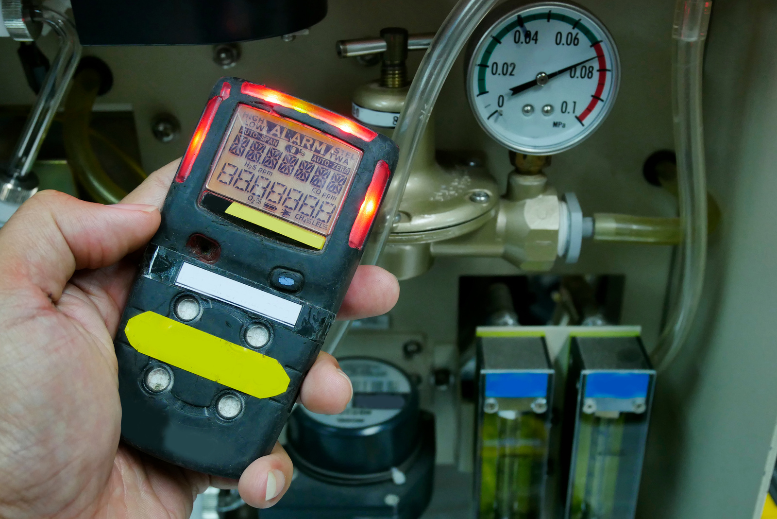 Personal H2S Gas Detector,Check gas leak. Safety concept of safety and security system on offshore oil and gas processing platform, hand hold gas detector for check hydrocarbon leak to protect fire and explosion.